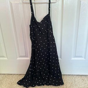 Black and white polka-dotted flowy dress